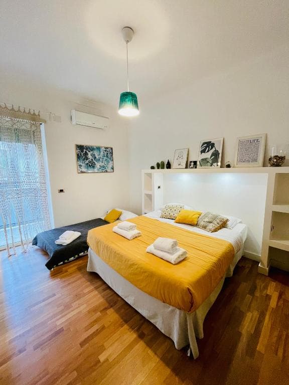 Bedroom with double bed and an additional single bed